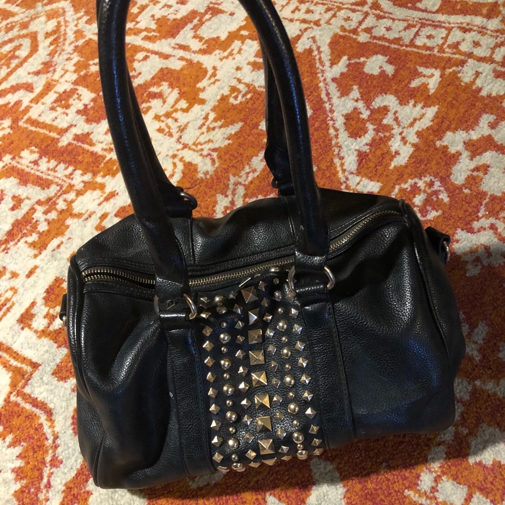 Black purse with gold studs